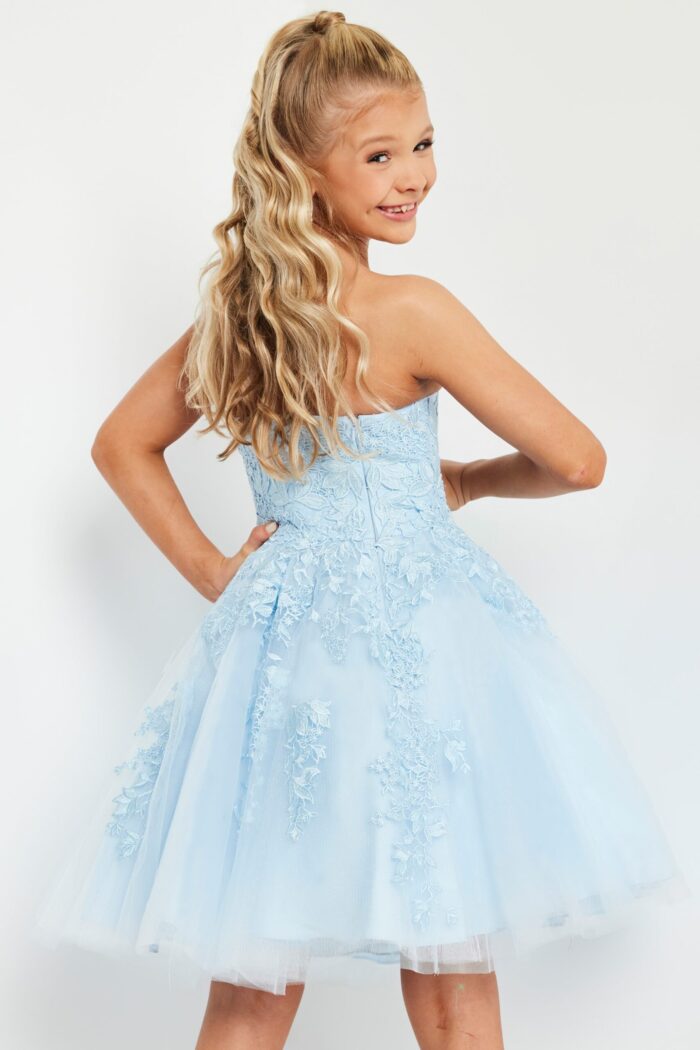 model wearing K1830 blue dress with floral lace design, back view