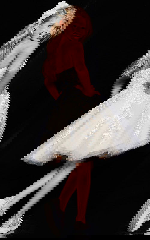 model wearing K1830 beige dress with floral lace design, back view