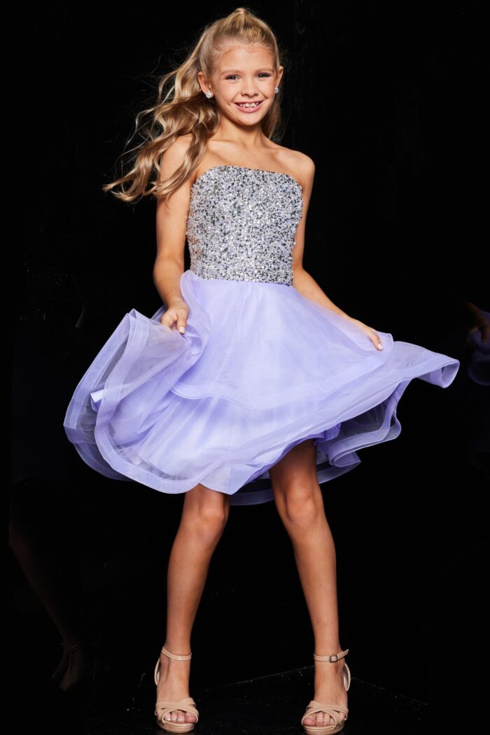 Young model wearing Jovani K23666 lilac dress with sequin bodice, front view.