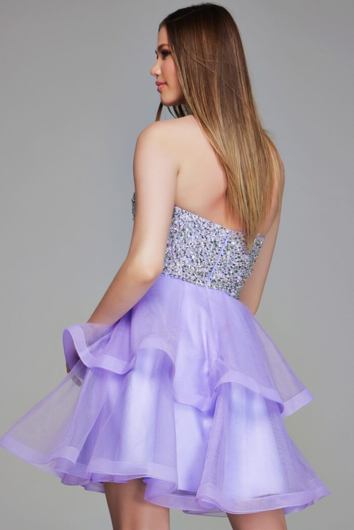 Model wearing Jovani K23666 lilac dress, back view showing sequined bodice.