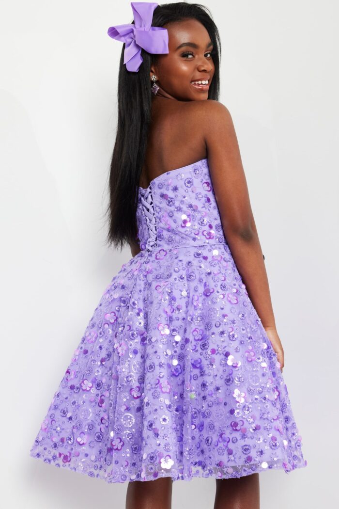 Model wearing Jovani K23685 lilac dress showing lace-up back detail