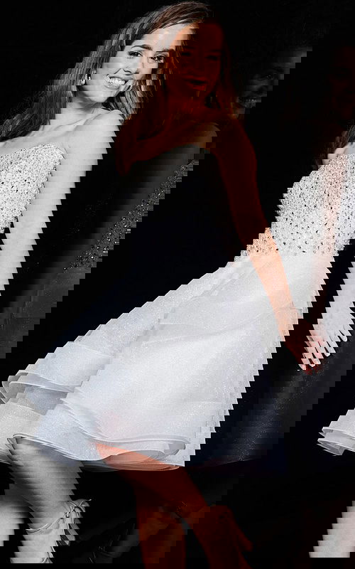 Model wearing Jovani K24050 ivory dress with embellished bodice, front view.