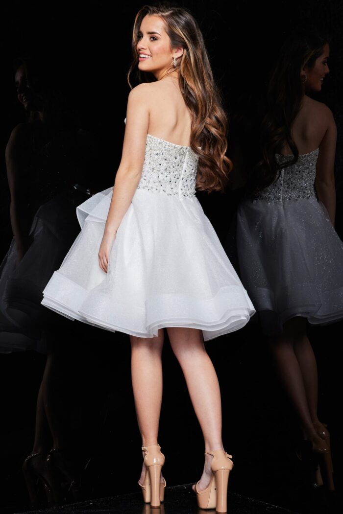 Jovani K24050 ivory dress from back view, showcasing layered skirt.