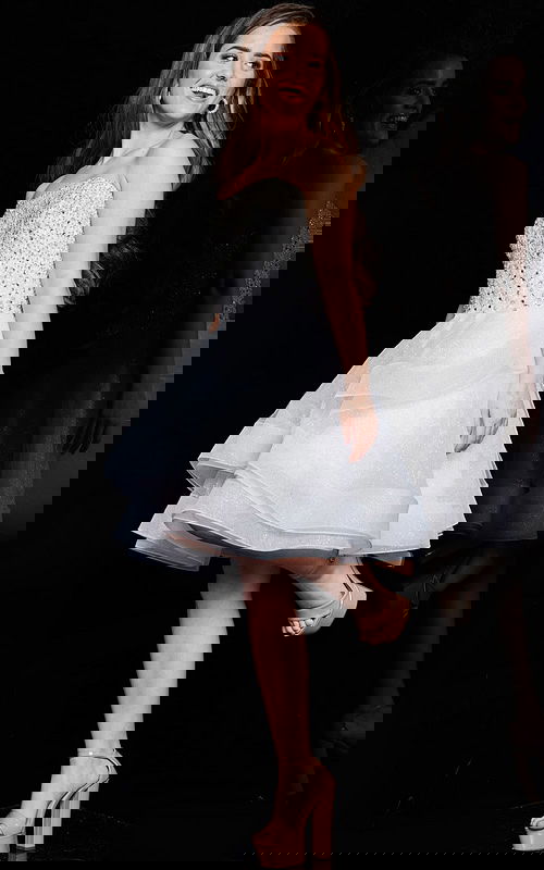 Model wearing Jovani K24050 ivory short dress in front view.