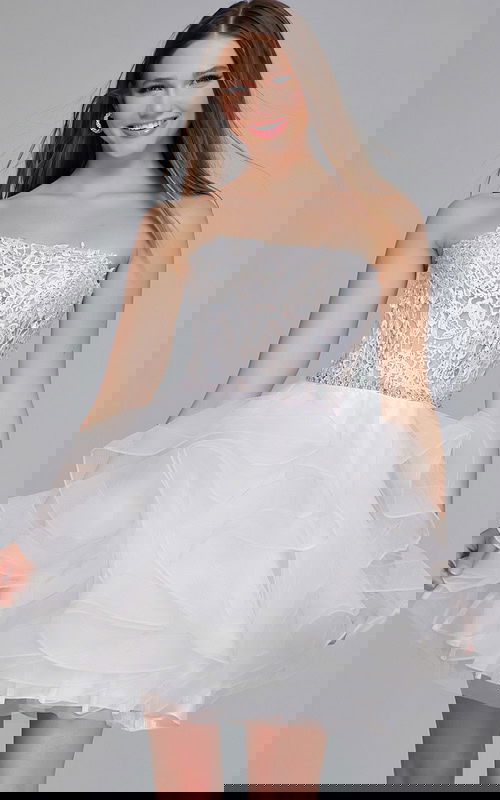 Model wearing Jovani 24371 white dress with strapless lace bodice and tulle skirt, front view.