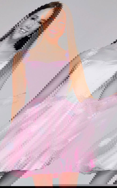 Model wearing K25989 pink dress front view with floral accents