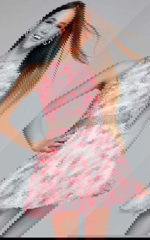 Model wearing K26290 pink cocktail dress with halter neckline and floral appliqués, front view.