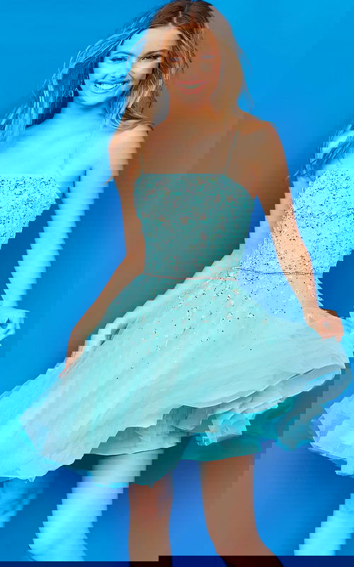 Model wearing Jovani K3641 blue dress with a square neckline and embellished bodice, front view