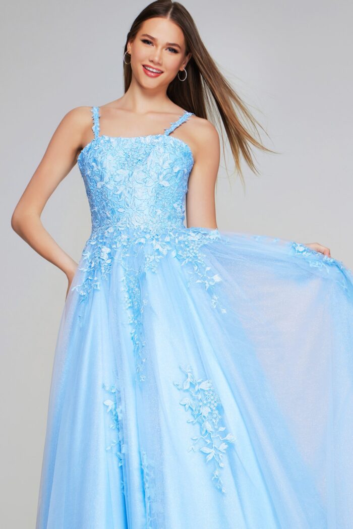 Model wearing Jovani K38098 light blue dress flaunting the floral appliqué design