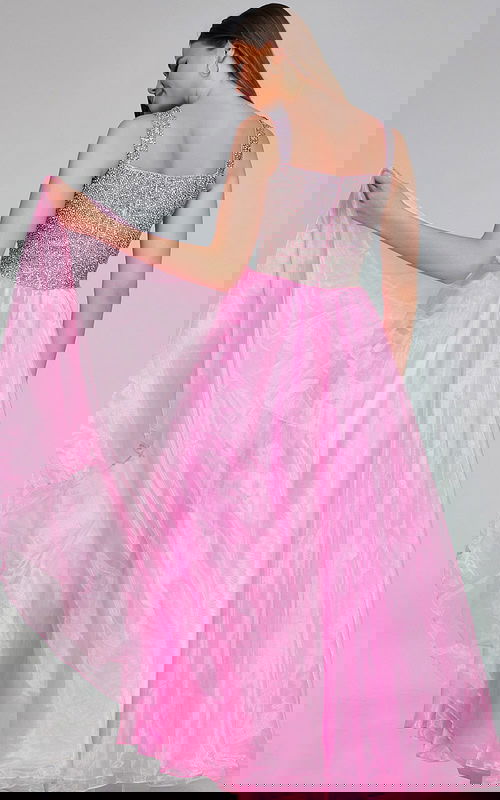 Back view of model in Jovani K38261 pink dress with detailed bodice.