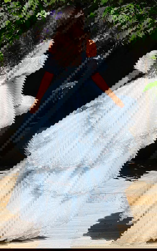 Off shoulder ruffle gown with layered skirt