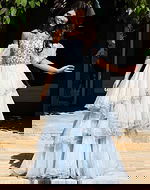 Jovani K42178 light blue ball gown with crystal beaded bodice, sheer puff sleeves, and tiered ruffled organza skirt with scattered rhinestone accents