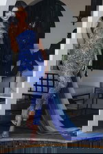 Jovani K44932 sapphire light blue one shoulder beaded jumpsuit with crystal embellishments and flowing chiffon cape train