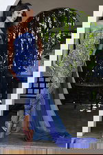 Jovani K44932 sapphire light blue one shoulder beaded jumpsuit with crystal embellishments and flowing chiffon cape train