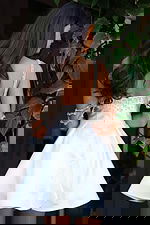 Jovani K48024 off white satin square neck short A line dress with crystal beaded neckline, draped rhinestone arm chain details, and full pleated flare skirt