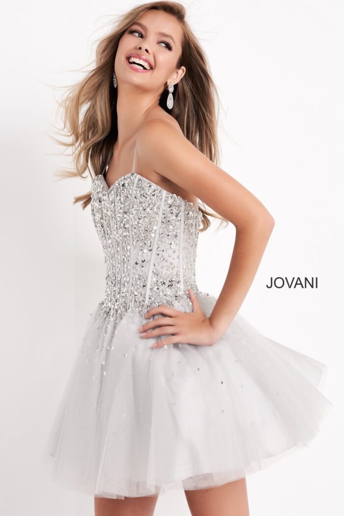 Model in silver Jovani K59903 showing side view with sequin details
