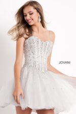 Model showcasing Jovani K59903 in silver with dazzling bodice