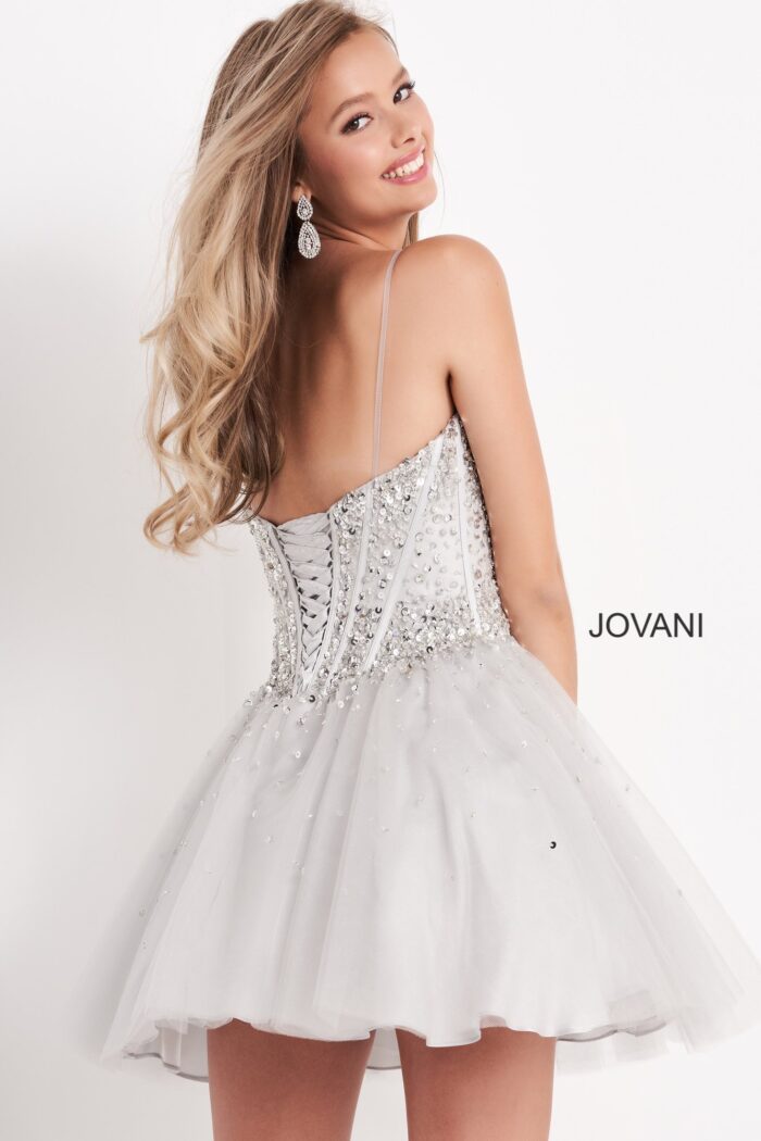 Back view of model in silver Jovani K59903 with laced design