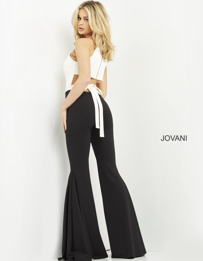 Model wearing Jovani M02807 jumpsuit, back view with elegant tie detail.