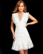 Model wearing Jovani m02856 white dress with V-neckline and lace cap sleeves.
