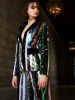 Front view of Jovani M02942 on model, a stylish and colorful sequin ensemble.