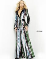 Model showcasing Jovani M02942, capturing the full length and shine of the pantsuit.