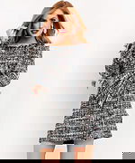 Model wearing Jovani M03273 multi-color tweed mini dress with off-shoulder neckline and fringed details, front view.