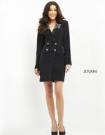 Full view of model wearing Jovani M03416 black dress with long sleeves and embellished neckline.