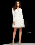 Model wearing Jovani M1262 ivory dress with feather trim and button details.