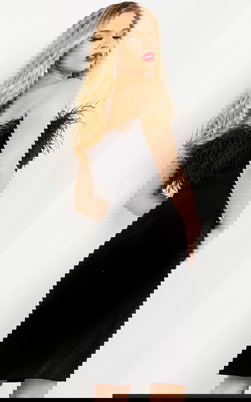 Model showcasing the back view of the M3335 black dress with a sophisticated silhouette.