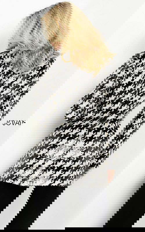 Back view of M3393 black and ivory houndstooth dress worn by model.