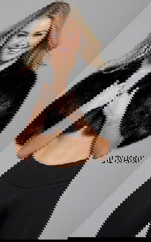 Model wearing Jovani M50165 black dress with beaded detail, front view.