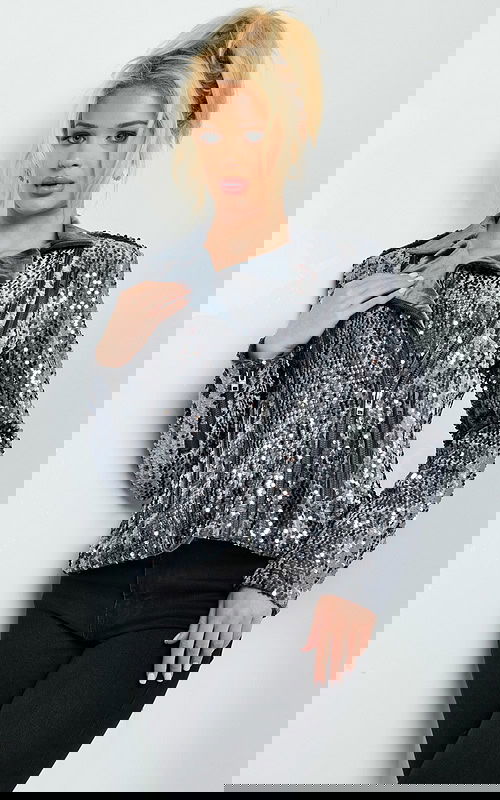 Model wearing Jovani M61427 gunmetal sequin jacket, front view