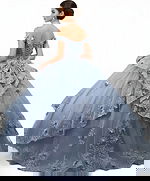 Off-shoulder blue ball gown with tiered lace back