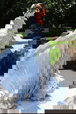 Elegant gown featuring crystal embroidery and flowing chiffon cape