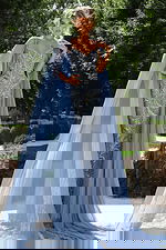 Light blue beaded gown with sheer cape and sweetheart neckline