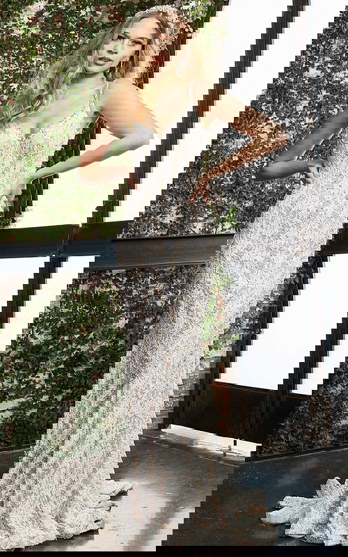 Model wearing S60534 elegant white lace gown, front view with floral lace details.