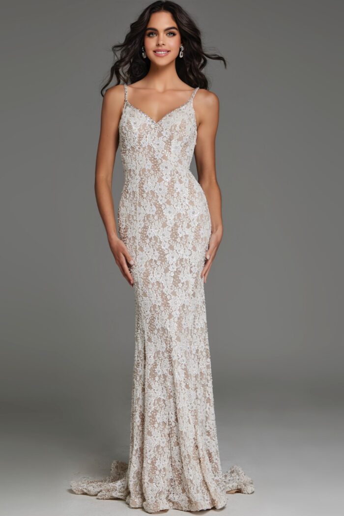 Model wearing S60534 elegant white lace gown with V-neckline, front view.