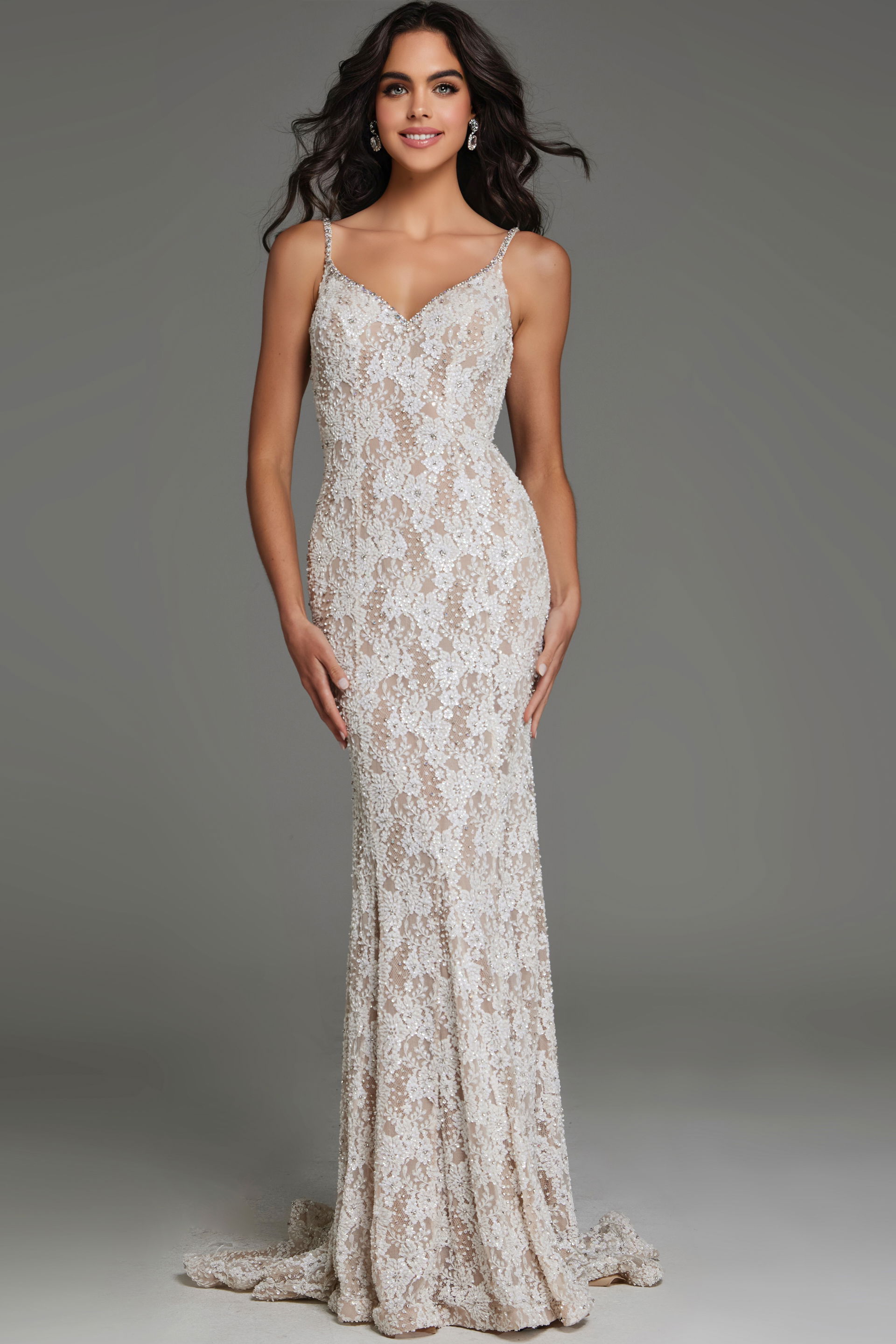S60534 Model wearing S60534 elegant white lace gown with V-neckline, front view.