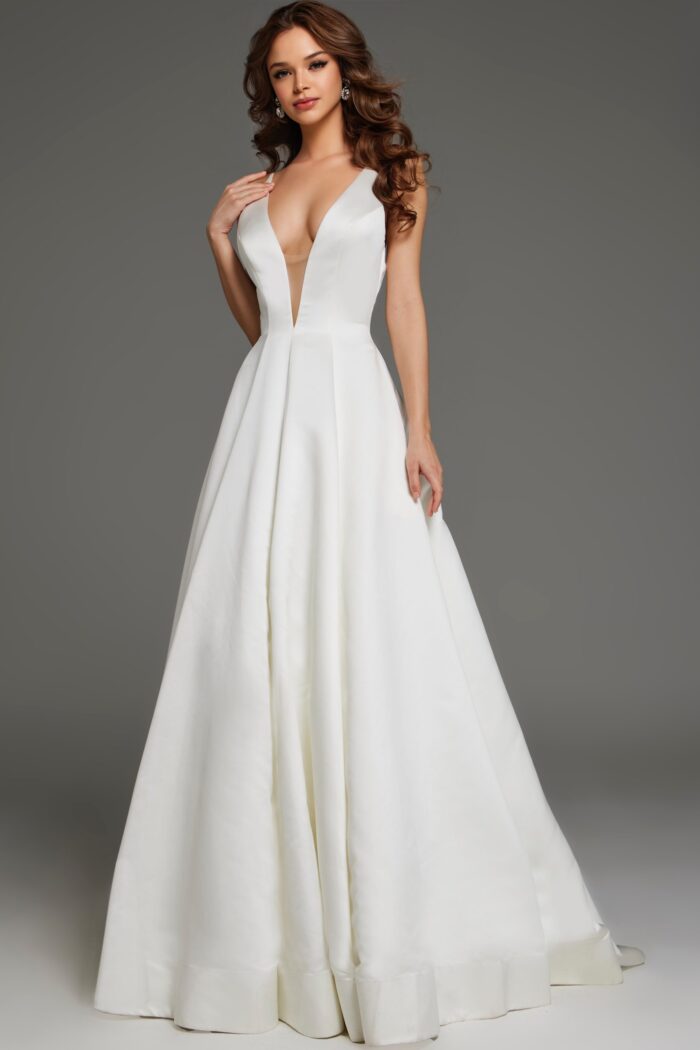 Model wearing Jovani S62445 elegant white A-line gown with deep V-neckline