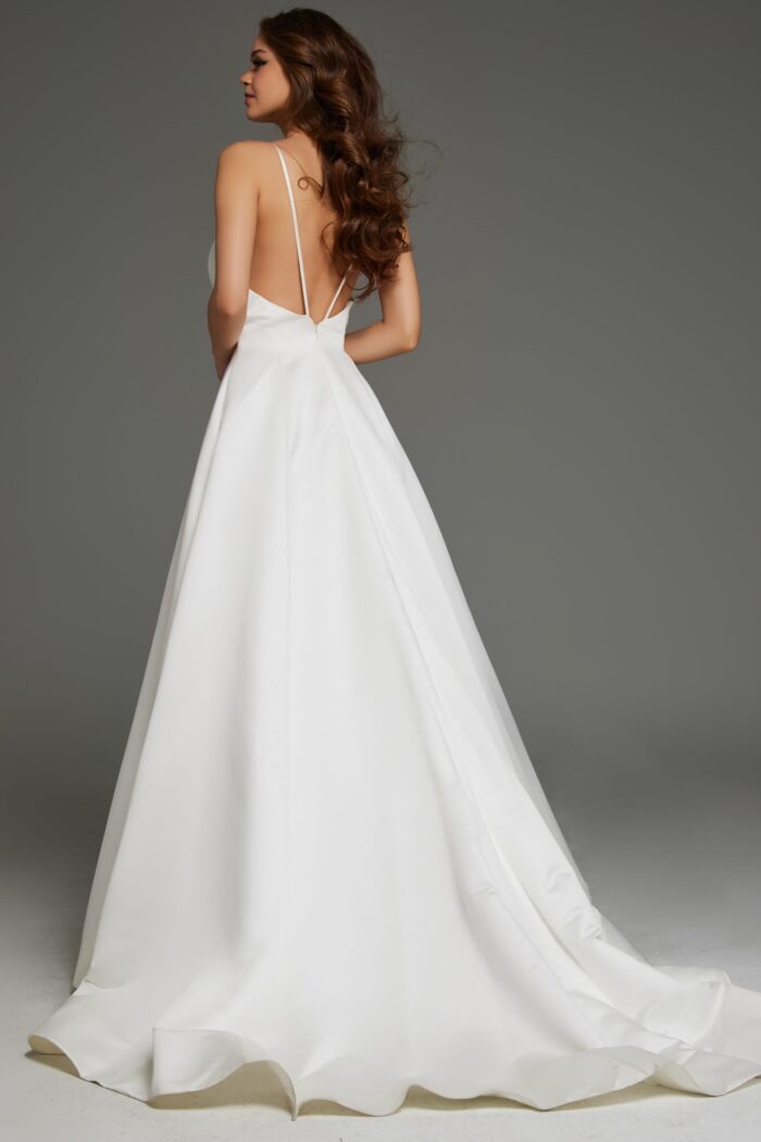 Model showcasing back of Jovani S62445 gown featuring open V-back design