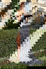 Sparkling fitted gown with shimmering pattern and elegant sweep train