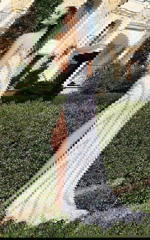 Sparkling fitted gown with shimmering pattern and elegant sweep train