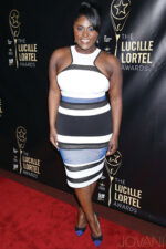 Full view of model wearing M449 dress, styled with a halter neckline and multi-colored stripes at the Lucille Lortel Awards.