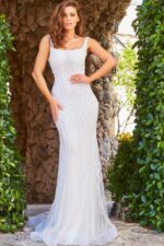 Model wearing Jovani JB06666 front view with scoop neckline and beadwork.