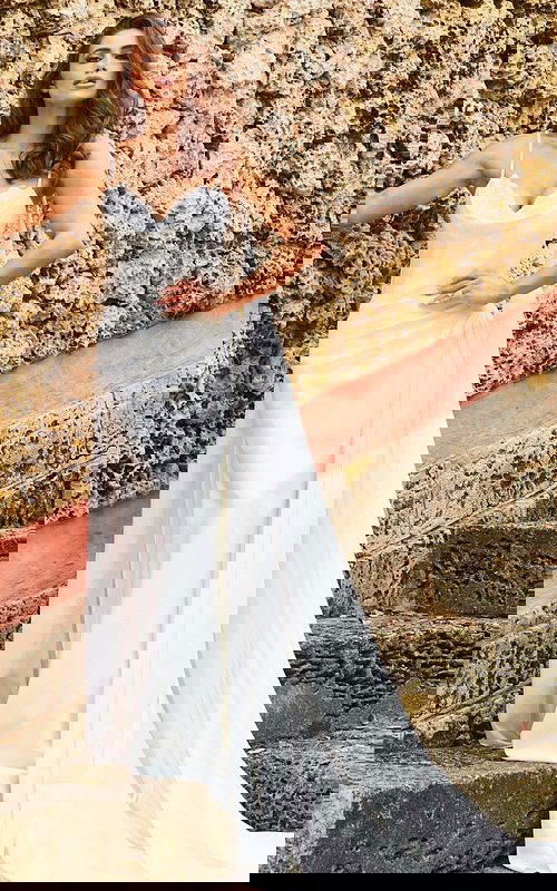 Model wearing Jovani JB07139 white gown with scoop neckline and flowing train, front view.