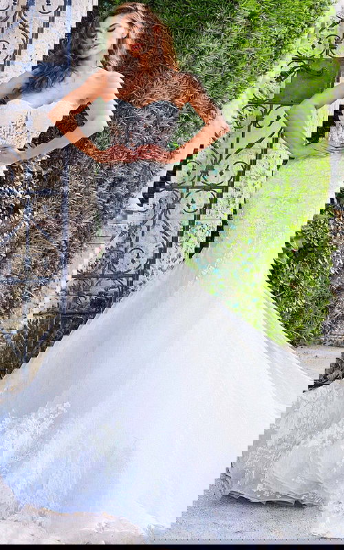 Model wearing Jovani JB07260 dress with a sweetheart neckline and mermaid silhouette in white