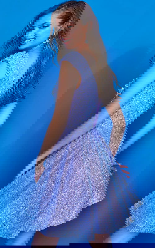 Model wearing Jovani K04446 lilac dress showing back details.