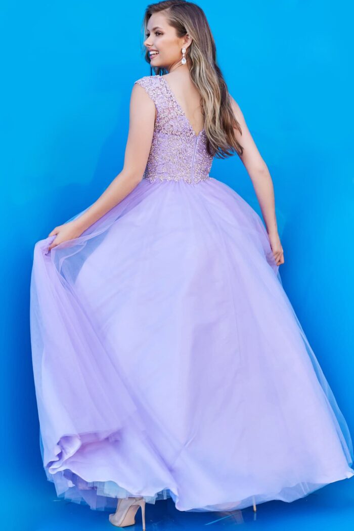 Back view of model in K06822 lilac gown with sweeping A-line skirt and lace details.