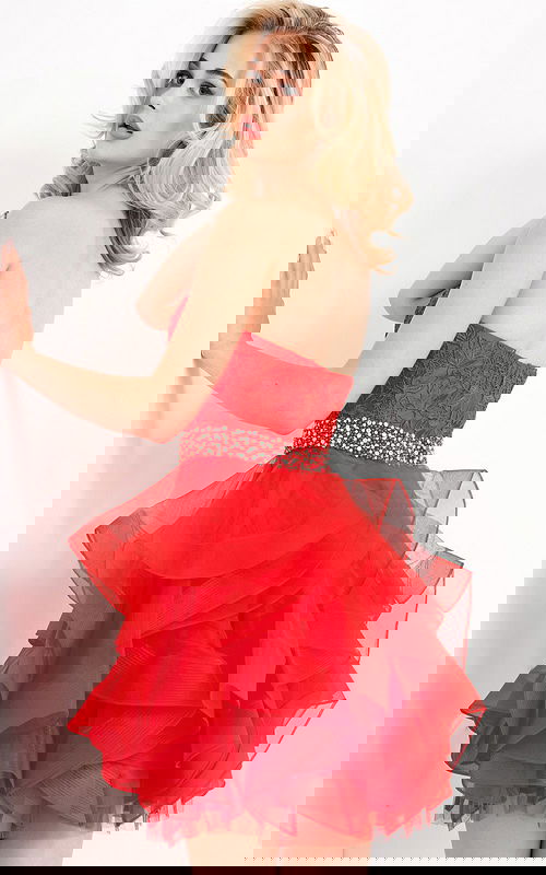 model wearing Jovani k3099 red dress with lace bodice and layered tulle front view